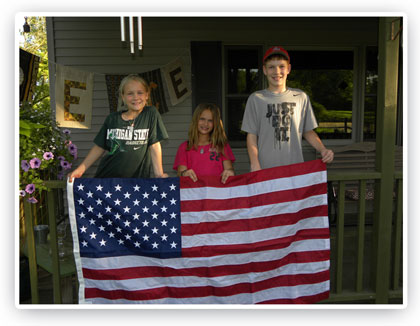 Luttig children with flag flown over our nations capital in Curt's honor.